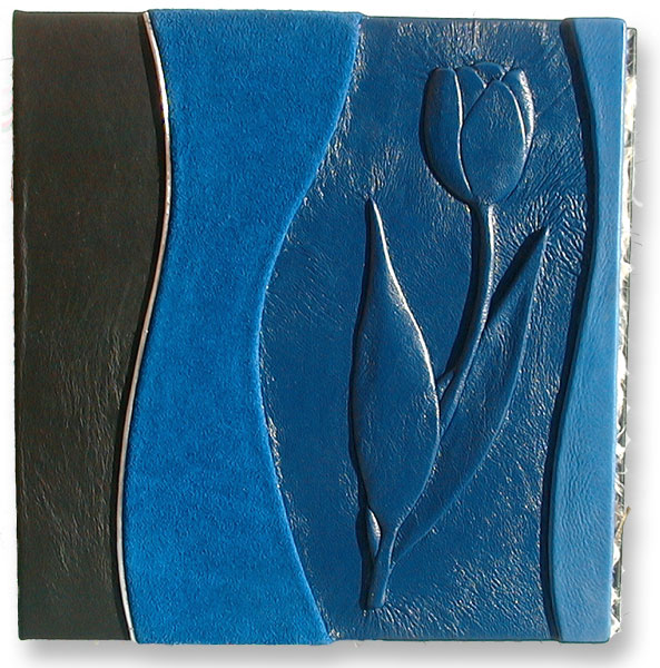 blue leather three ring binder with handcarved and embossed tulip on the cover