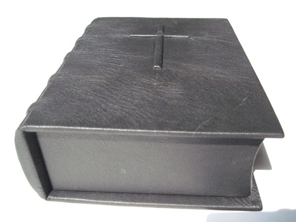 end view of black leather religious box with embossed cross on the cover