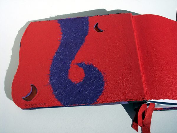 leather book interior with stained glass moon windows and handmade paper