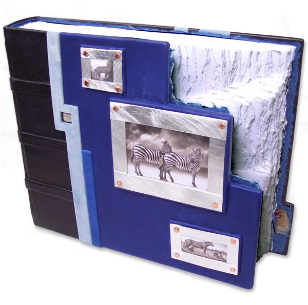 Stepped Photo Window Book with three silver framed slide-in photograph windows and odd shaped blue leather book cover