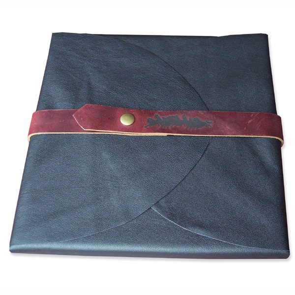 Soft black leather portfolio folder wrapping a book, business logo branded onto a snapped belt