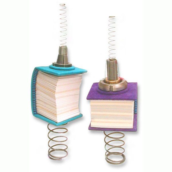 Sculptural Books mounted on steel springs, balanced as a sculpture, but functional