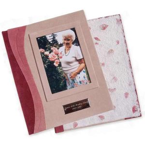Engraved Name Plate Book book with pink leather, photo of woman with roses, an etched silver name plate, and handmade paper endsheets with flower petals in screwpost book