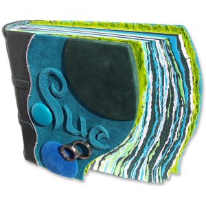 Turquoise embossed leather name Sue on personalized photo album