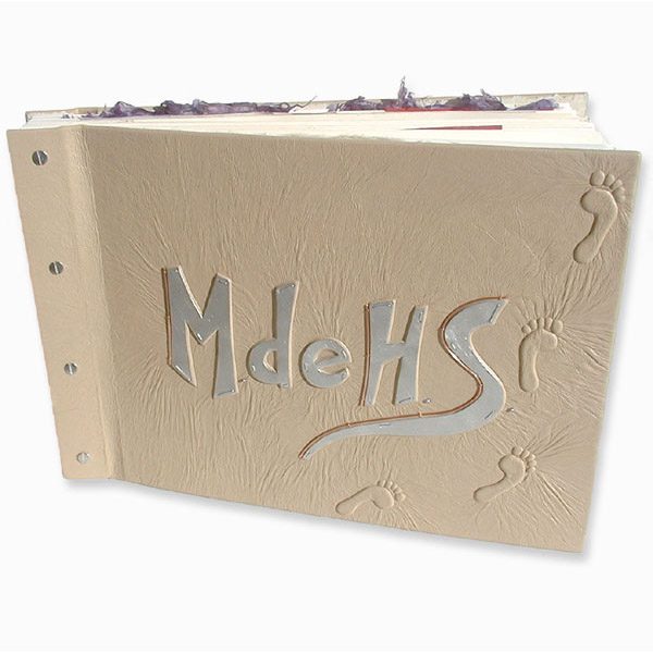 Beige leather scrapbook with brushed silver capped embossed initials and 3-D footprints on screwpost scrapbook