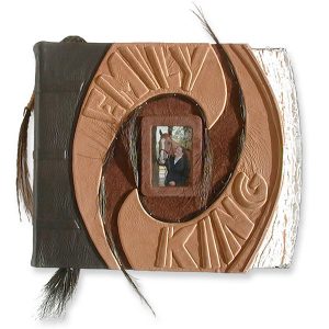 equestrian scrapbook in brown leather with horsehair, framed photo of horse and girl under glass, embossed lettering Emily and King