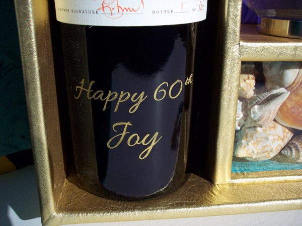 Etched wine bottle in gold leeather showcase box, 60th birthday