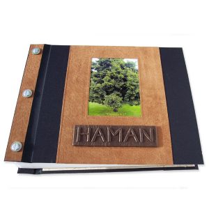 Refillable leather and fabric screwpost bound book covers with tree photograph and embossed lettering Haman on name plate
