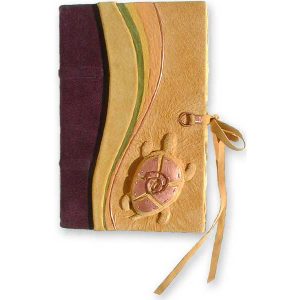 yellow leather handbound journal with carved embossed pond turtle with copper mosaic shell and leather lace tie closure