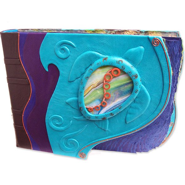 stained glass sea turtle windows in turquoise leather photo album with copper S curve and curved deckled edge blue pages