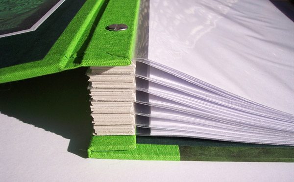 Internal screwposts on fabric covered book