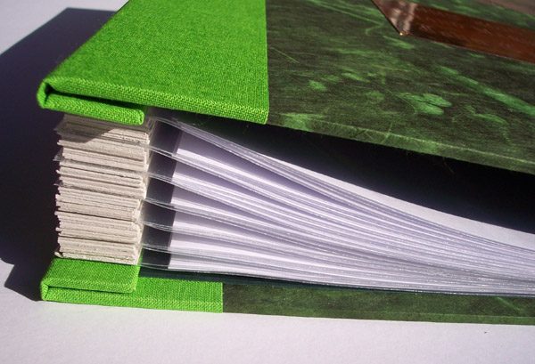 Book spine edge with plastic pages
