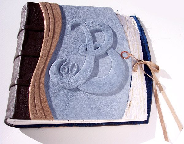 60th anniversary book with B initial and leather lace tie