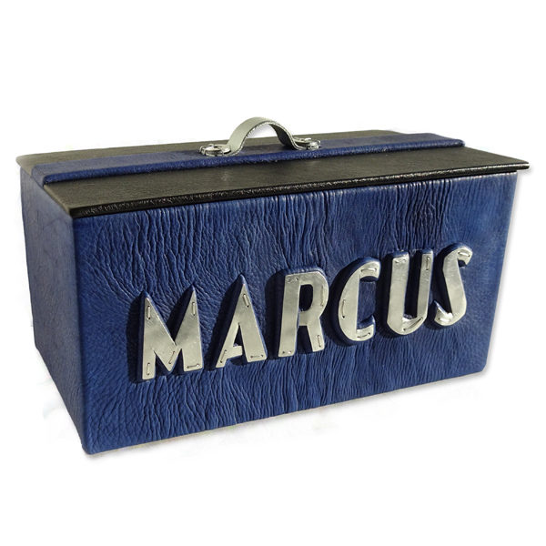 Blue leather box with black lid, metal handle, and silver capped name Marcus