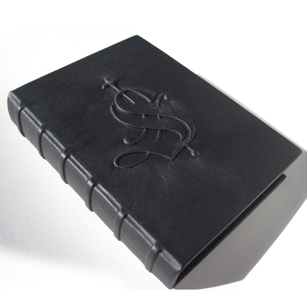 Clamshell black leather box with spine cords and embossed old english initial S