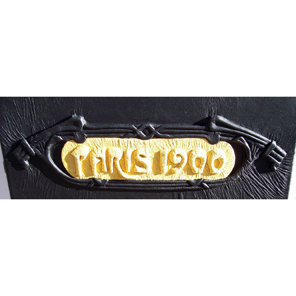 Paris 1900 embossed yellow plaque on custom black leather box cover