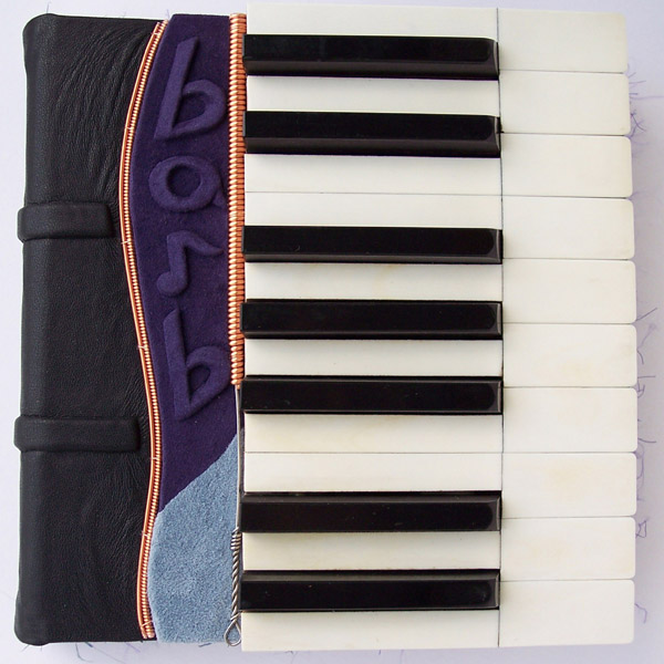 ebony ivory piano keys custom leather journal with piano wire and name