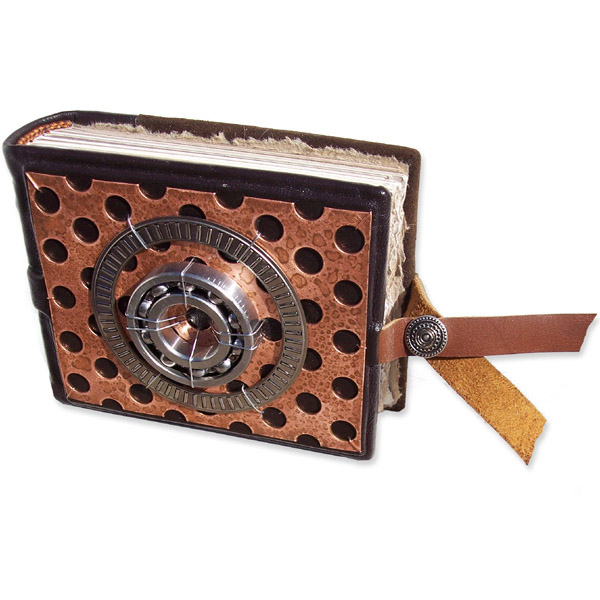 Snapped blank handbound leather journal with car part art - perforated metal plate and two steel roller bearings