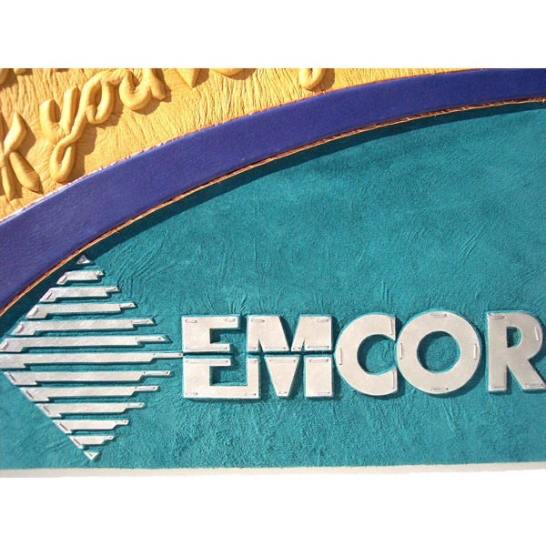 Metal capped EMCOR logo with diamond emblem over embossed suede teal lather on custom leather book cover