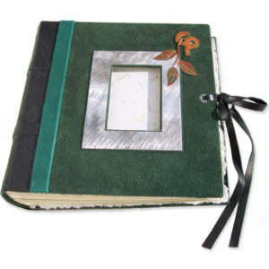 green suede wedding album with silver photo frame, copper vine, linked initials, leather lace closure