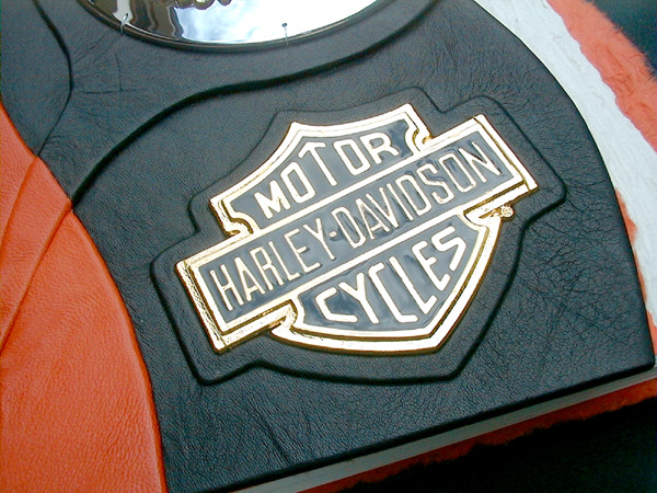 Harley Davidson Bar and Shield emblem on black leather book cover