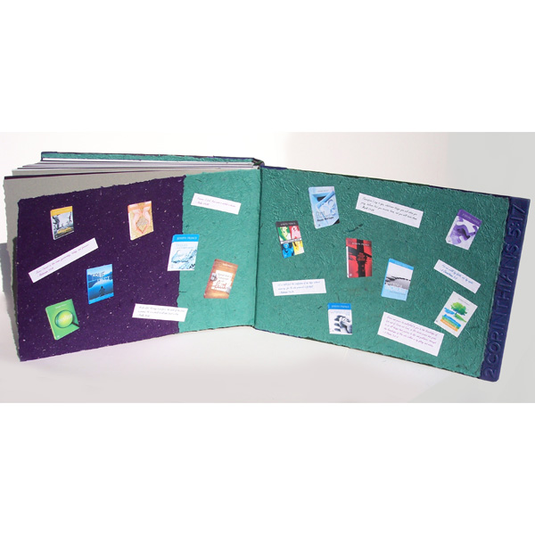 decorated endsheets in custom scrapbook with Joseph Prince book covers and Bible verses