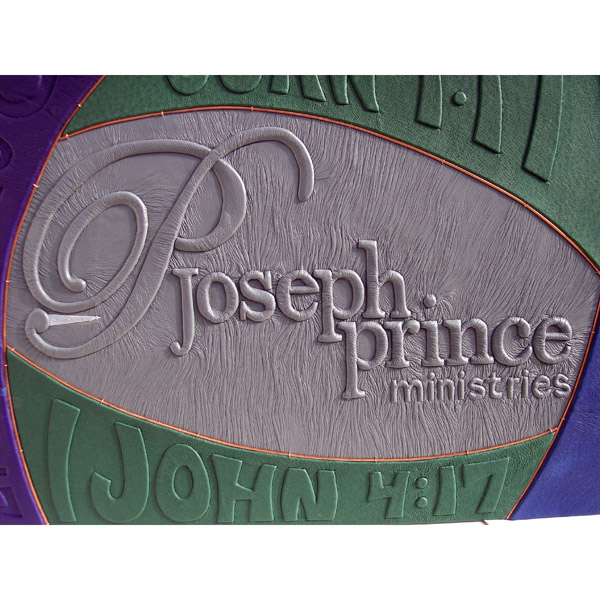 Joseph Prince Ministries logo embossed under gray leather on custom scrapbook cover with Bible verses