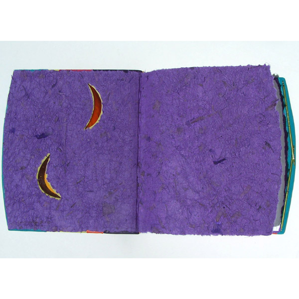 purple handmade paper endsheets and stained glass moons in handbound book