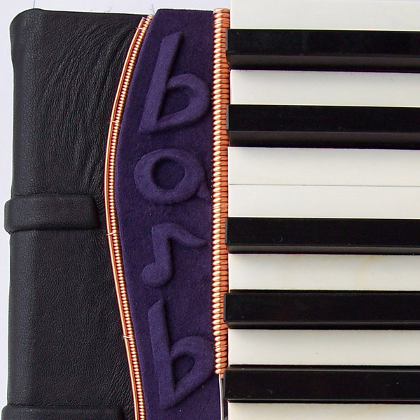 purple leather embossed name Barb on personalized leather piano keys music book