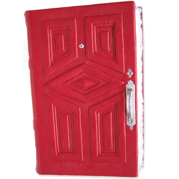 red leather door journal with silver hardware and diamond panel in center