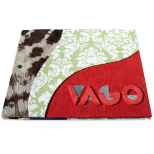 Leather and fabric personalized artist portfolio book with curved panels and embossed name VAGO under red suede