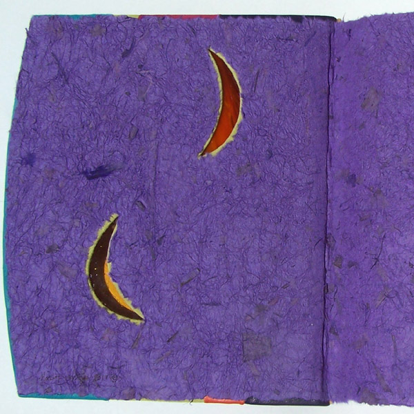 stained glass moon windows through leather scrapbook cover with purple paper