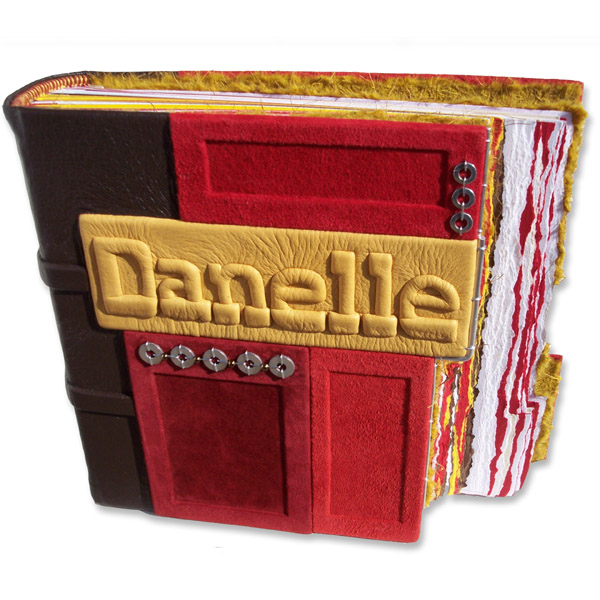 Red and gold mosaic panels on personalized leather photo album with embossed name plate Danelle and stepped book edges