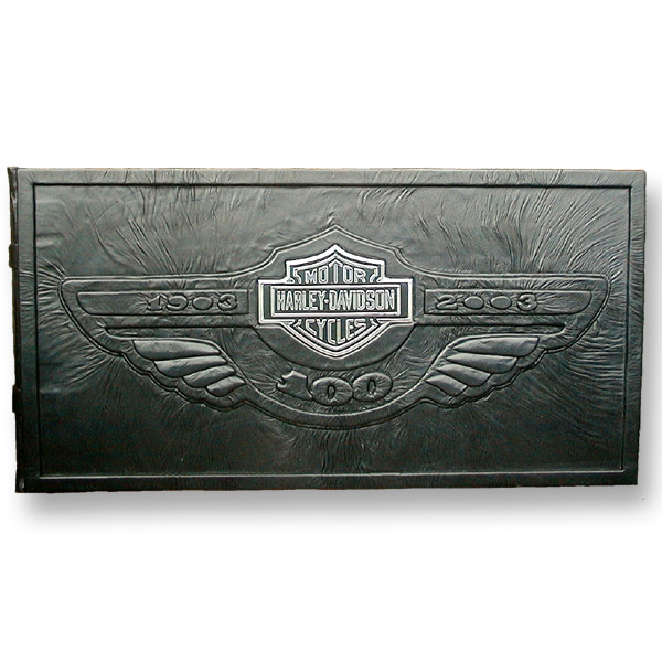 Harley-Davidson 100th Anniversary Book with Bar and Shield logo over black leather