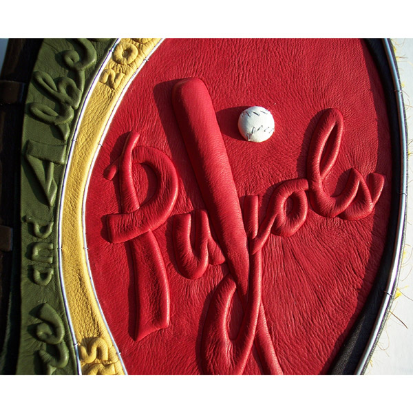 Pujols script lettering embossed under red leather with baseball and bat on custom wedding album with names and date