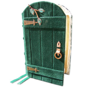 gate gate bible in green suede leather with arched top, glass windows, and copper vine and hardware