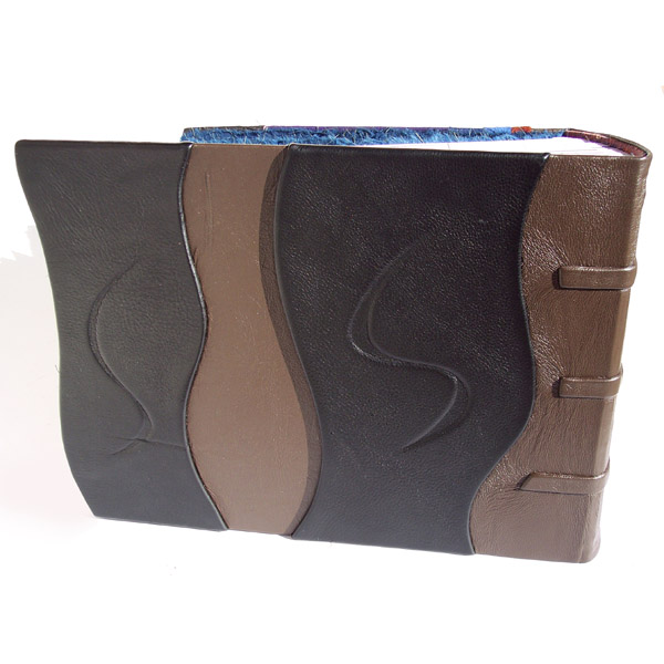 multi level back cover of leather photo album with engraved swirls