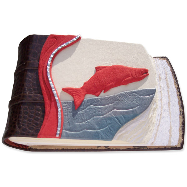 Sockeye Salmon Leather Scrapbook with carved red leather wrapped salmon sculpture over river on nature scene book cover