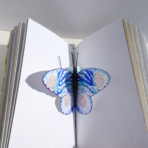Painted Pop-Up Butterfly Hidden in Book Pages