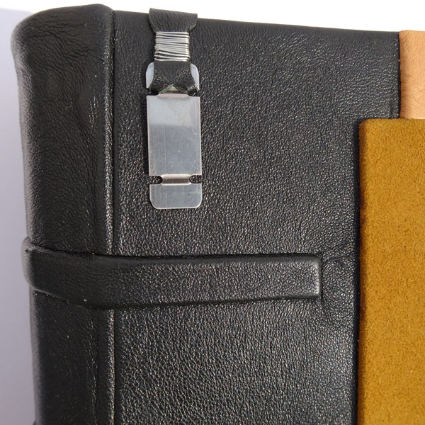 Steel Truck Part as Bookmark Pendant on Leather Book